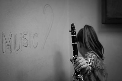 Close-up of woman holding clarinet