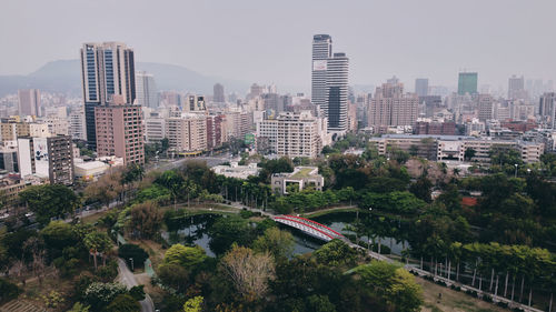 High angle view of buildings in city against sky