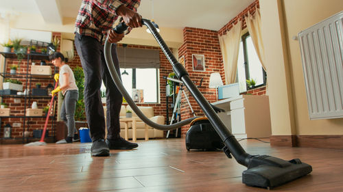 Low section of man working at gym