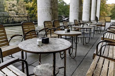 Empty chairs and table at outdoor cafe