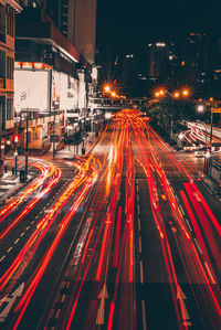 High angle view of light trails on road at night