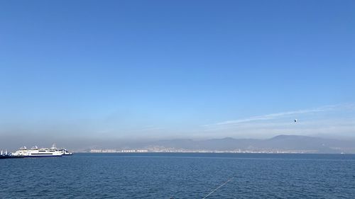 Scenic view of sea against blue sky
