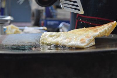 Close-up of preparing food in kitchen