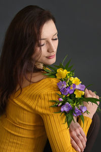 Woman holding flower bouquet