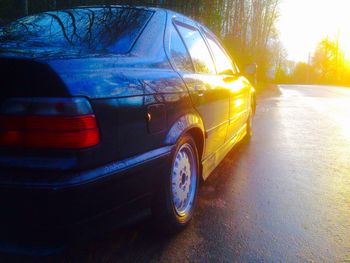 Close-up of car on road