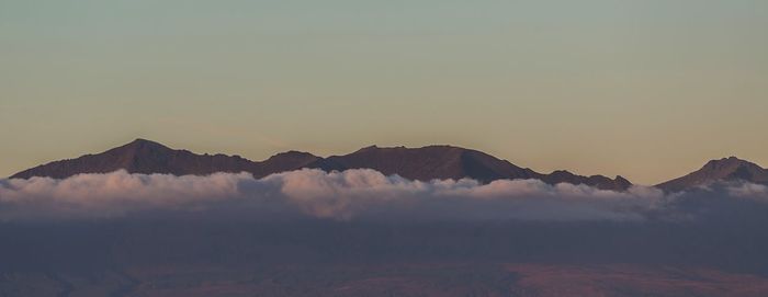 Scenic view of mountains against sky during sunset