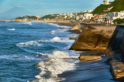 Panoramic view of beach and buildings against sky