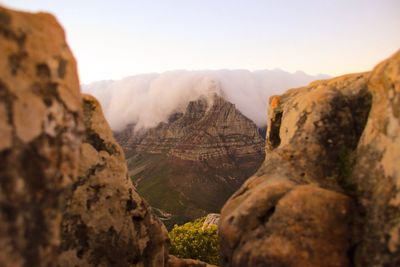 Rock formation on land against sky