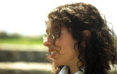 Portrait of a young woman looking away