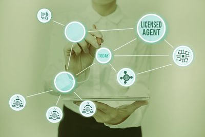 Digital composite image of hand with text