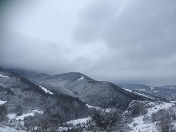 Scenic view of mountains against sky during winter