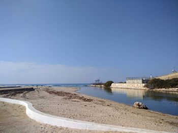 Scenic view of sea against blue sky