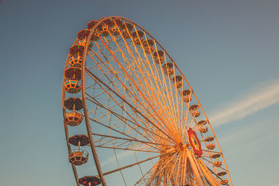 Low angle view of ferris wheel against sky