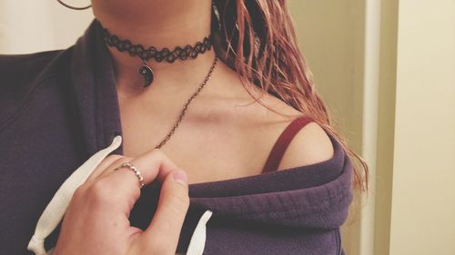 Close-up of sensuous woman wearing choker