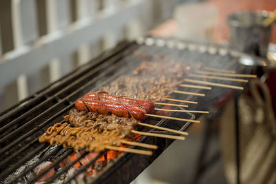 Close-up of meat on barbecue grill