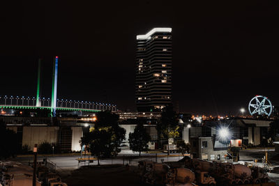 Illuminated buildings in city at night