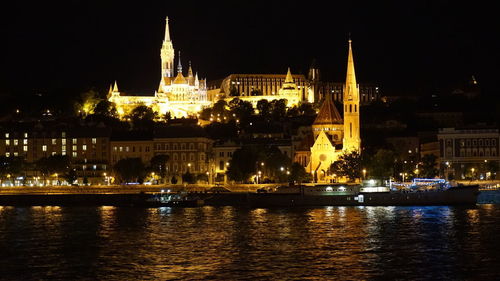 Illuminated buildings at waterfront