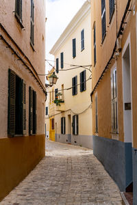 Narrow street amidst buildings in town