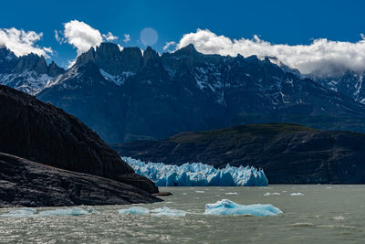 Scenic view of snowcapped mountains against sky