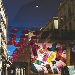 Low angle view of lanterns hanging in city