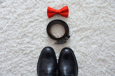 Close-up of personal accessories on rug