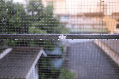 Close-up of wet window in rainy season