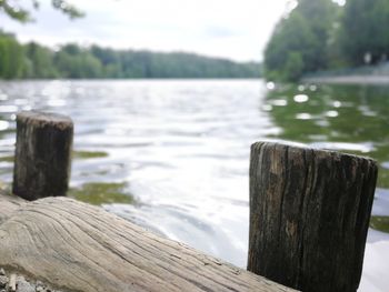 Wooden fence by lake