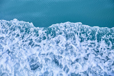 High angle view of waves splashing in sea