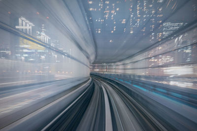 Blurred motion of illuminated railroad tracks at night