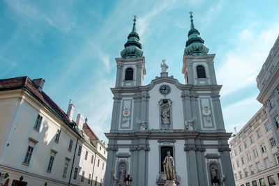 Low angle view of statue of building against sky