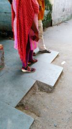 Low section of woman standing on floor