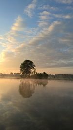 Scenic view of lake at sunset