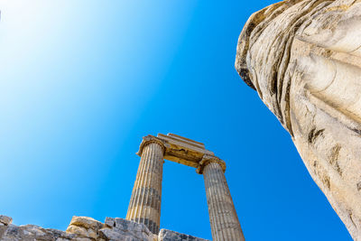 Low angle view of historical building against blue sky