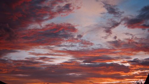 Low angle view of dramatic sky during sunset