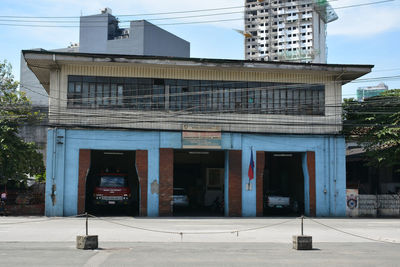 Exterior of building by street against sky