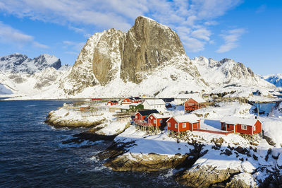 Wooden houses on rocky coast