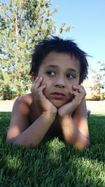 Portrait of boy on field