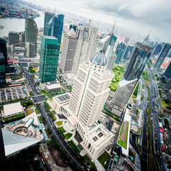 High angle view of modern buildings in city against sky