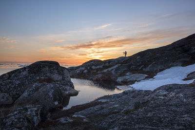 Scenic view of sea against sky at sunset