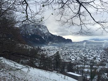 Scenic view of snow covered mountains against sky