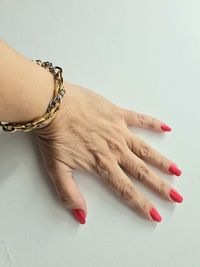 Cropped hand of woman with nail polish