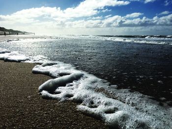 Scenic view of sea against sky during winter