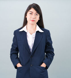 Portrait of a beautiful young woman over white background