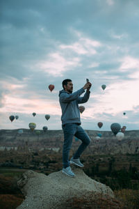 Full length of man standing on rock