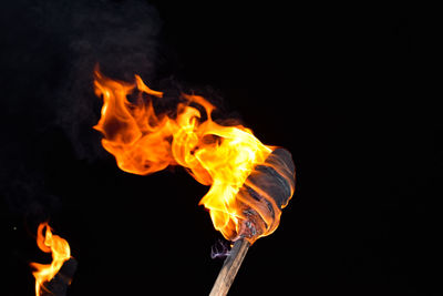 Close-up of bonfire against black background