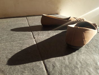High angle view of shoes on tiled floor