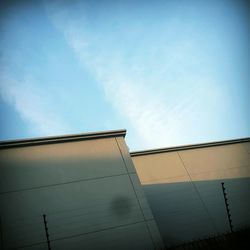 Low angle view of building against blue sky