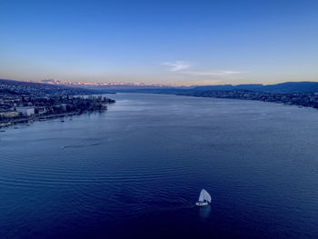 High angle view of sea against blue sky
