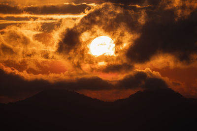 Low angle view of dramatic sky at sunset