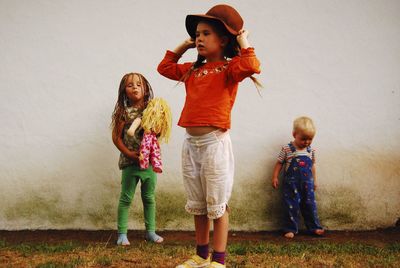 Children on field against wall